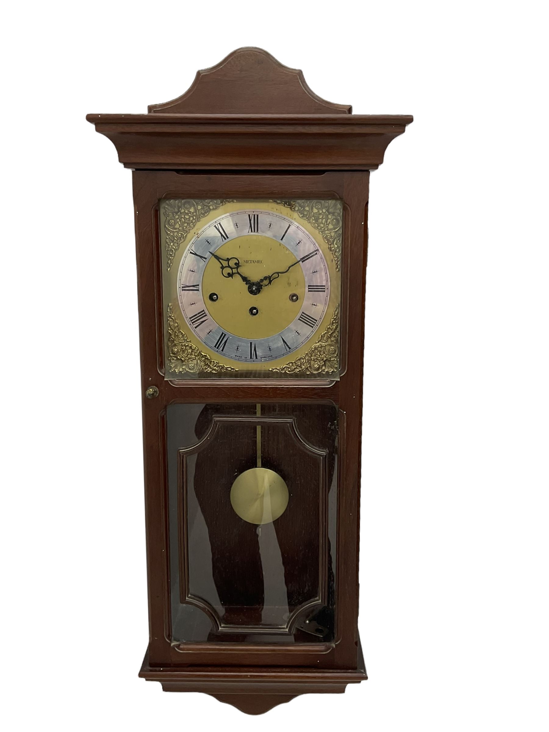 A 20th century wall clock in a simulated mahogany case with a two-part glazed door