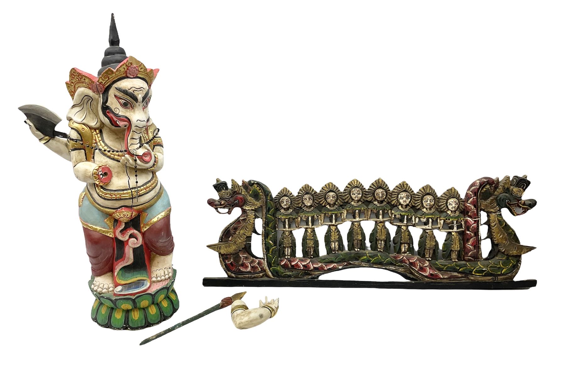 Balinese wood wall panel carved as a dragon boat with passengers