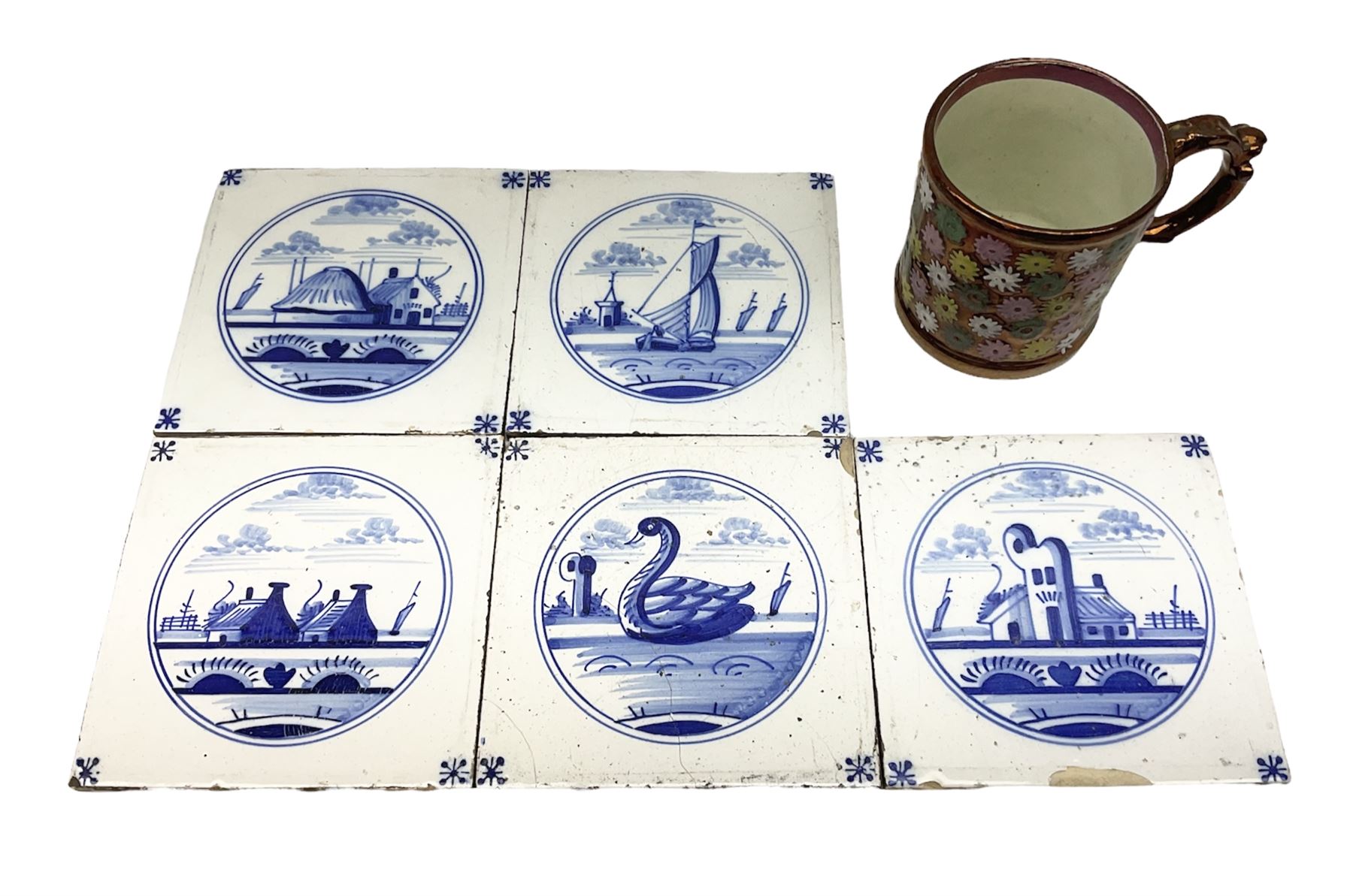 Five 19th century blue and white Delft tiles