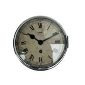 A bulkhead styled ships clock in a black metal case with an 8� chrome bezel and flat bevelled glass