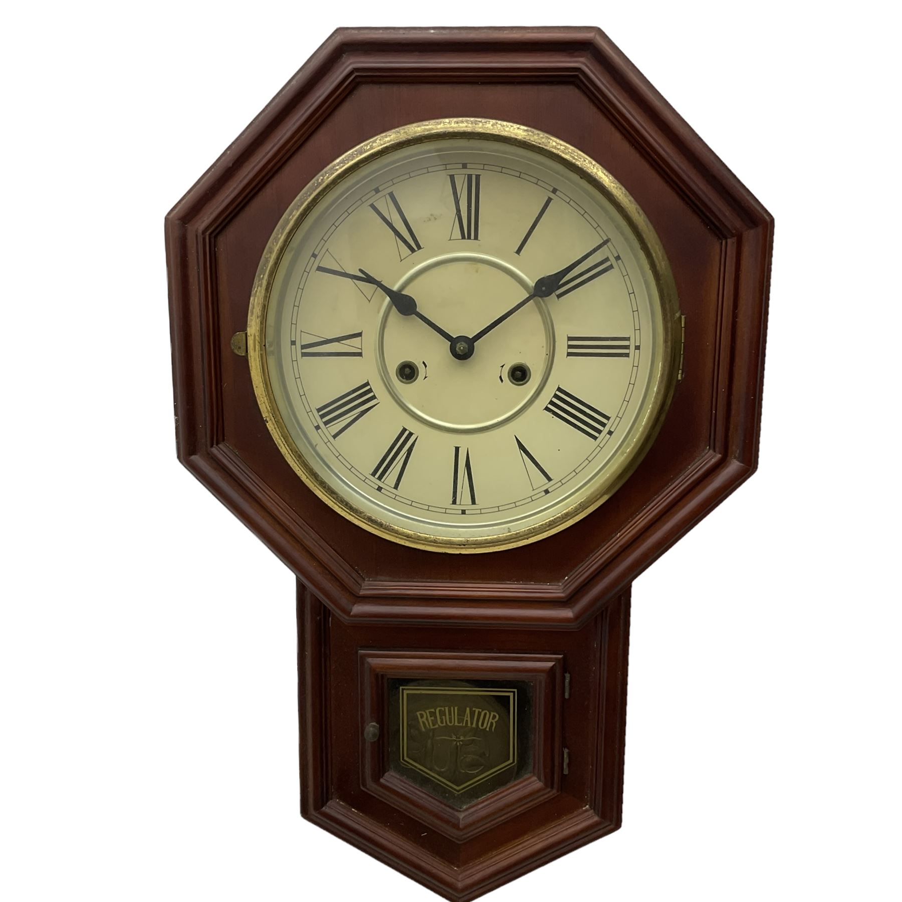 A mahogany effect American early 20th century �regulator� wall clock with an octagonal wooden dial s