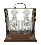 Late 20th century mahogany and silver plated two cut glass decanter tantalus