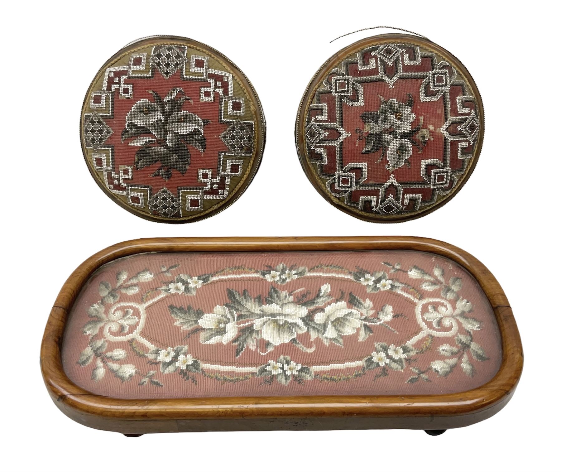Pair of Victorian beadwork footstools of circular form with a beaded and needlework upholstery