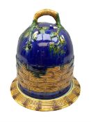 Majolica style cheese dome and dish with floral and woven basket effect decoration