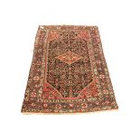 Persian red ground rug