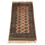 Small Persian Bokhara rug