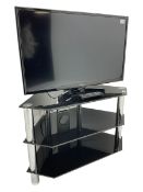Panasonic tv with remote and glass stand