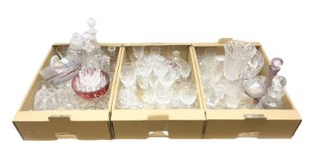 Three boxes of glassware to include four decanters with stoppers