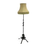 Wrought metal standard lamp with shade