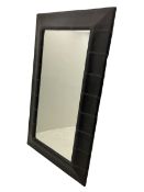 Large mirror with black leather panelled border and contrasting stitching