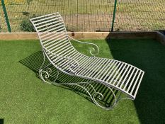 Wrought metal rocking garden lounger