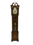 A 20th century �Grandmother� longcase clock in a light mahogany simulated case with a full-length gl