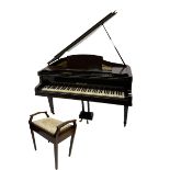 A mid 20th century English baby grand piano by Osbert