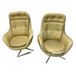 Parker Knoll - pair of swivel statesman chairs