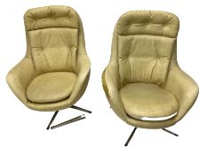 Parker Knoll - pair of swivel statesman chairs