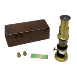 Victorian student's travelling brass monocular microscope H15cm; in fitted mahogany case with two ad