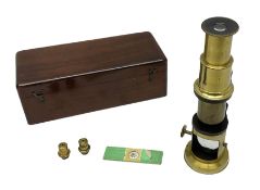 Victorian student's travelling brass monocular microscope H15cm; in fitted mahogany case with two ad