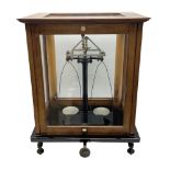 Set of laboratory balance scales by Reynolds & Branson of Leeds in fully glazed mahogany case with r