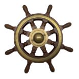 Brass bound teak ship's wheel with eight turned spokes and brass hub