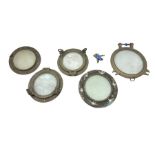 Four ship's large glazed brass portholes