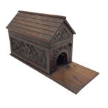 Late Victorian oak box in the form of a dog kennel with hinged roof