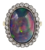 Early 20th century gold milgrain set oval opal and old cut diamond cluster ring
