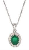 18ct white gold oval emerald and round brilliant cut diamond cluster pendant