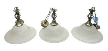 Three frosted glass light fittings with brushed metal mounts