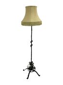 Wrought metal standard lamp with shade