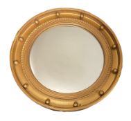 Convex circular gilt wall mirror