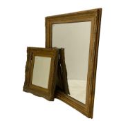 Bevelled mirror in swept gilt frame (79cm x 97cm)