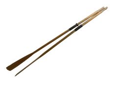 Pair of wooden oars with metal collars