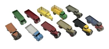 Dinky - eleven unboxed and playworn/repainted early die-cast commercial vehicles including flatbed a