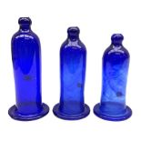 Set of three graduating hand blown blue glass smoke bells