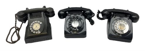 Three black Bakelite telephones with rotary dials