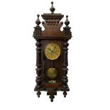 A late 19th century German wall clock c1880 with an 8-day HAC spring driven movement striking the ho