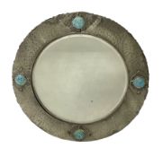 Arts & Crafts style circular hammered pewter mirror inset with four turquoise cabochons