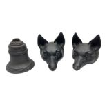 Two cast iron fox masks and a cast iron doorstop