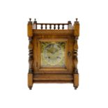 An early 20th century oak cased mantle clock in the arts and crafts style