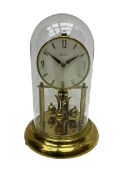 A mid-20th century “Bentima” 400-day anniversary torsion clock with a 7” circular brass base