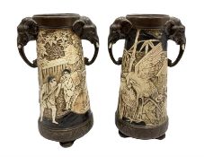 Pair of Bretby vases of tapering cylindrical form decorated with elephants