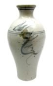 Studio pottery vase of baluster form with a light mottled blue ground with abstract painted decorati