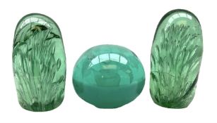 Pair of Victorian green glass dump paperweights with air bubble inclusions