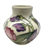 Moorcroft vase of squat form decorated in the Sweetness pattern by Nicola Slaney