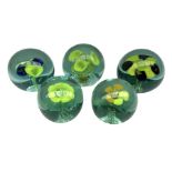 Five Victorian glass paperweights with flower inclusions