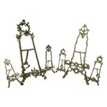 Collection of ornate brass easel picture stands