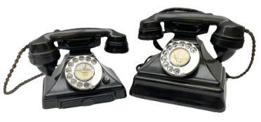 Two black Bakelite telephones of pyramid form with rotary dials