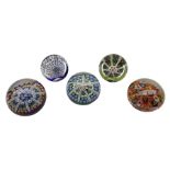 Five Millefiori glass paperweights