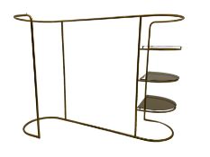 Brass shops display clothing rail