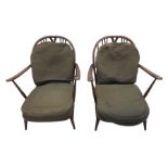 Ercol - pair of dark elm easy armchairs